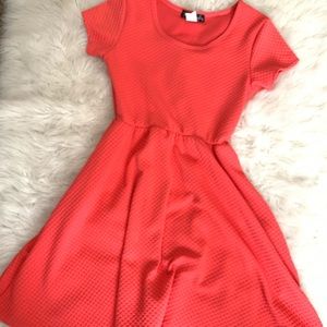Coral dress with cinched waist